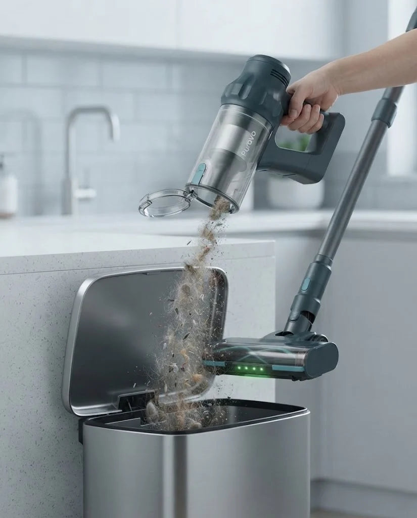 Puravo Stick held over a kitchen bin with its dust cup flipped open